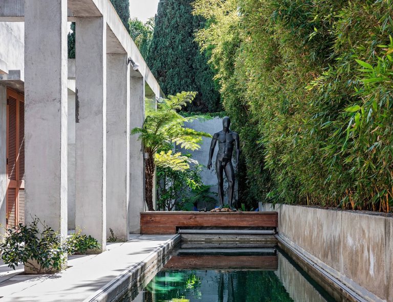 Example of a trendy backyard concrete and rectangular lap pool design in Los Angeles