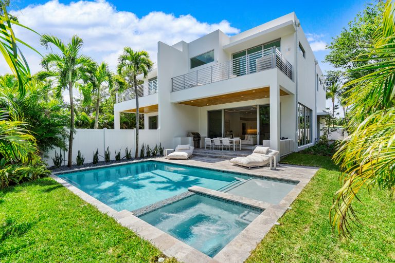 Example of a trendy backyard rectangular hot tub design in Miami