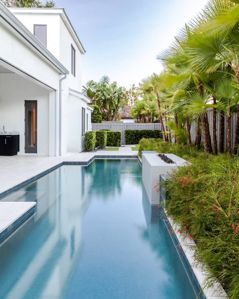 Example of a trendy backyard rectangular lap pool design in Orlando