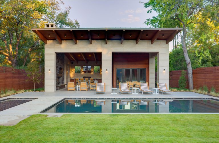 Example of a trendy backyard rectangular pool house design in Dallas