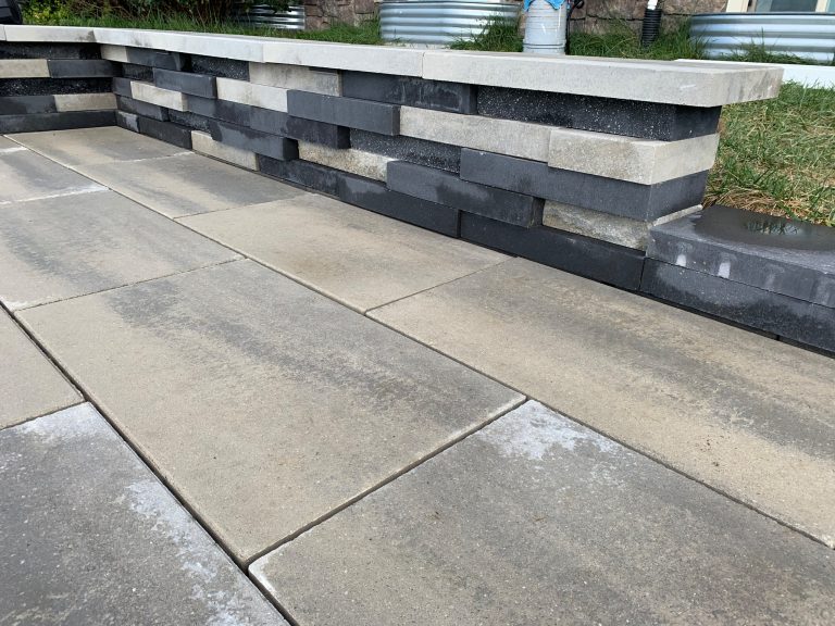 Example of a trendy concrete paver patio kitchen design in DC Metro