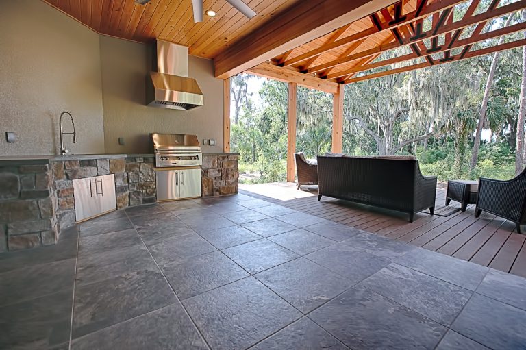 Example of a trendy patio design in Orlando by The Hauff Company | Outdoor Photos | Porch | Landscaping | Landscape Design | Outdoor Living Space | Porch Design Ideas | Outdoor Living Space Ideas | Backyard Design