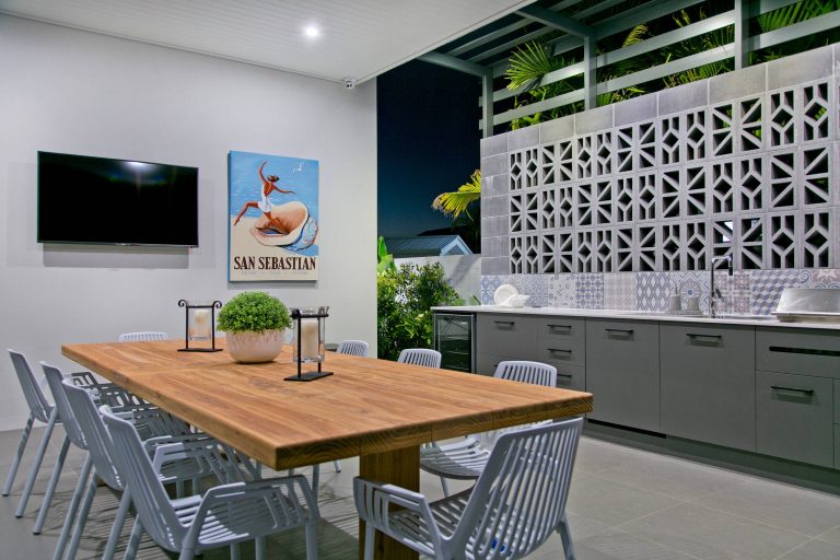 Example of a trendy tile patio kitchen design in Brisbane with a roof extension