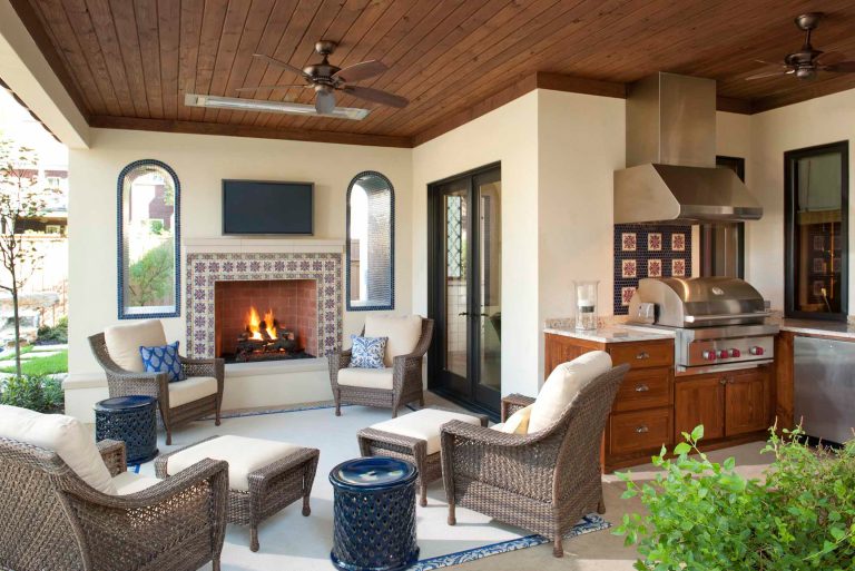 Example of a tuscan backyard patio kitchen design in Dallas with a roof extension