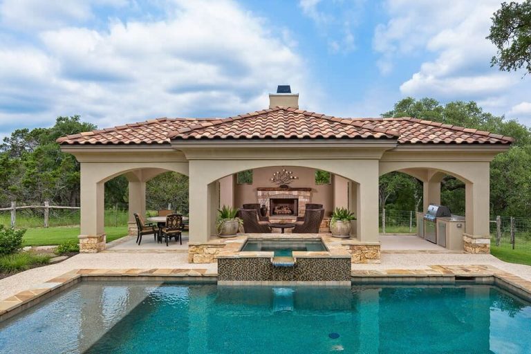 Example of a tuscan patio kitchen design in Houston with a gazebo