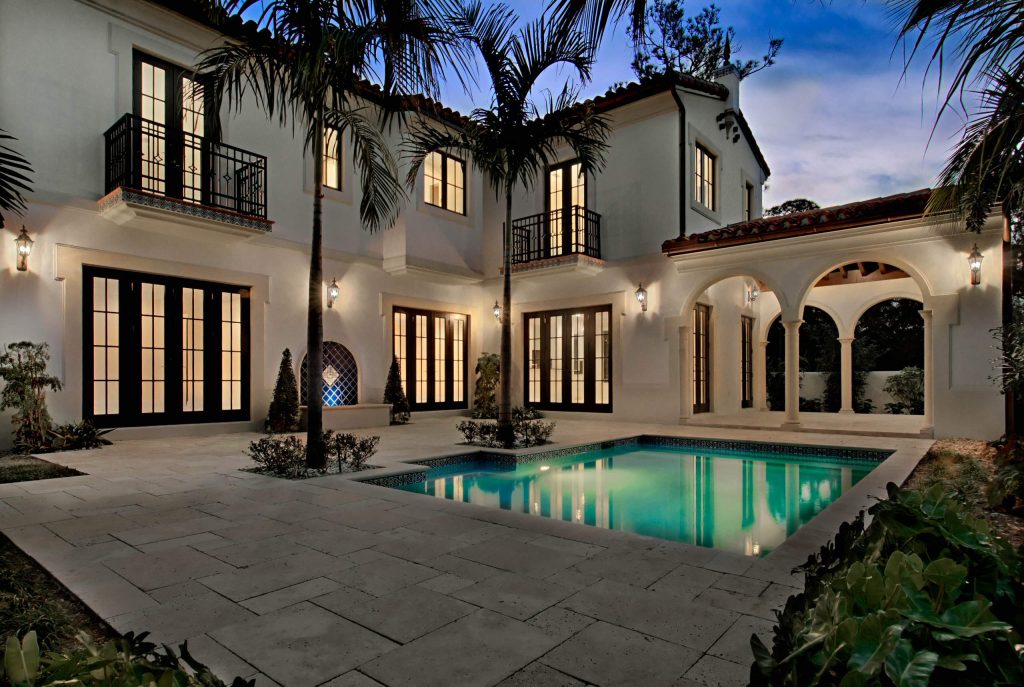 Expansive, custom pool and patio area with summer kitchen