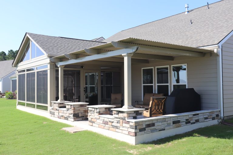 Exquisite Sunroom and Pergola in sandstone color.