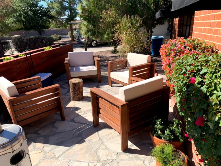 Extended flagstone walkway to a front yard patio