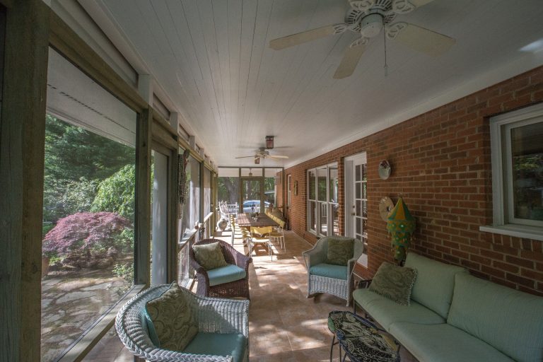 Exterior Painting: Even with late afternoon sunlight, this three season porch is nice and bright with Sherwin Williams Lauren's Surprise white exterior paint on the ceiling. by ProTect Painters of North Raleigh and Wake Forest | Outdoor Photos | Porch | Landscaping | Landscape Design | Outdoor Living Space | Porch Design Ideas | Outdoor Living Space Ideas | Backyard Design