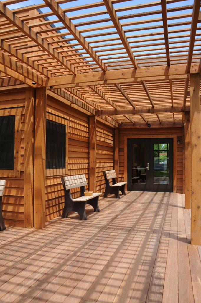 Exterior deck with benches, Lattice proves support for the Wisteria.