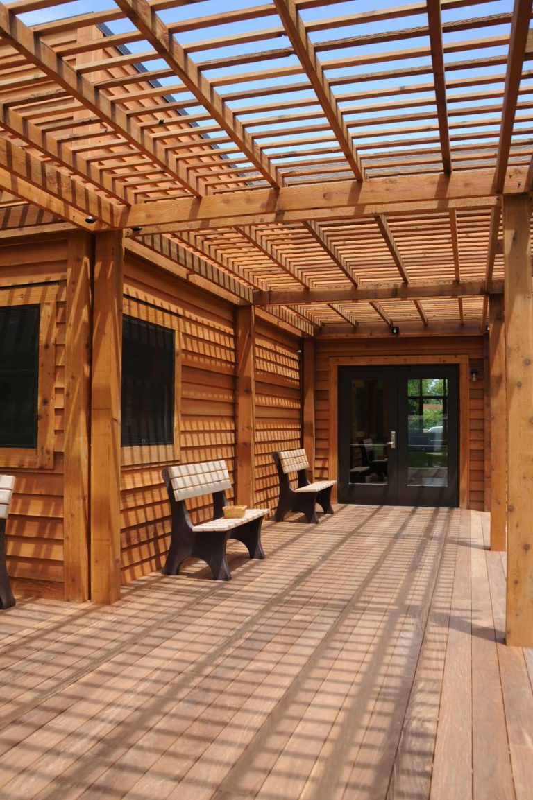 Exterior deck with benches, Lattice proves support for the Wisteria.