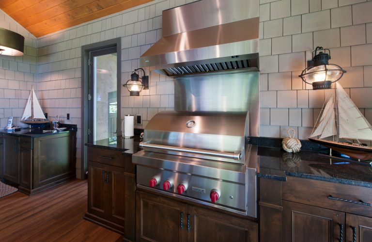 Exterior grade grill capped with a commercial grade exhaust hood. Cabinets flank the grill area for easy access to cooking needs. Photographed by Michael Braun. by EdgeWork Design Build | Outdoor Photos | Porch | Landscaping | Landscape Design | Outdoor Living Space | Porch Design Ideas | Outdoor Living Space Ideas | Backyard Design