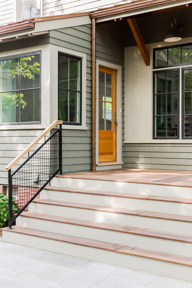 Exterior view of the porch leading up to a transitional-style Cambridge home. Photography by Michael J. Lee