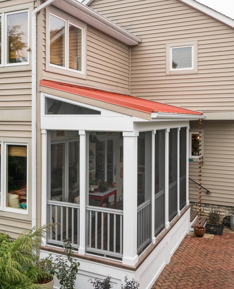 Exterior view screened porch addition, size 18’ x 6’7”, red metal roof Marshall Evan Photography