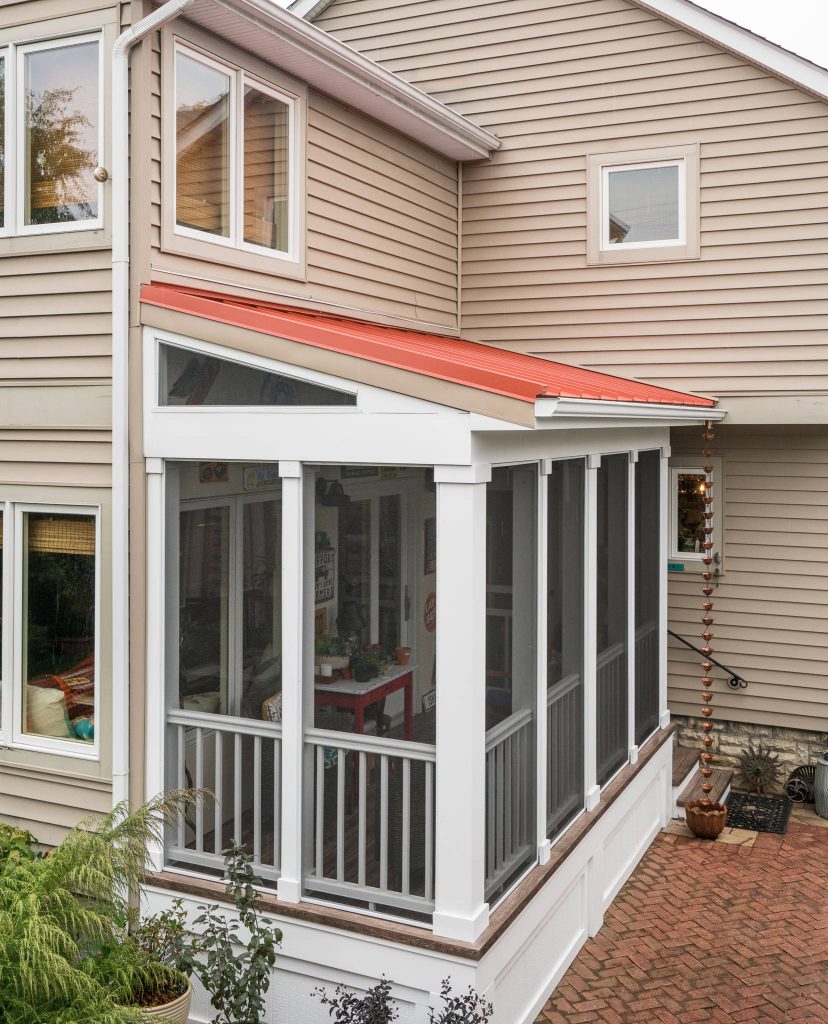 Exterior view screened porch addition, size 18’ x 6’7”, red metal roof Marshall Evan Photography