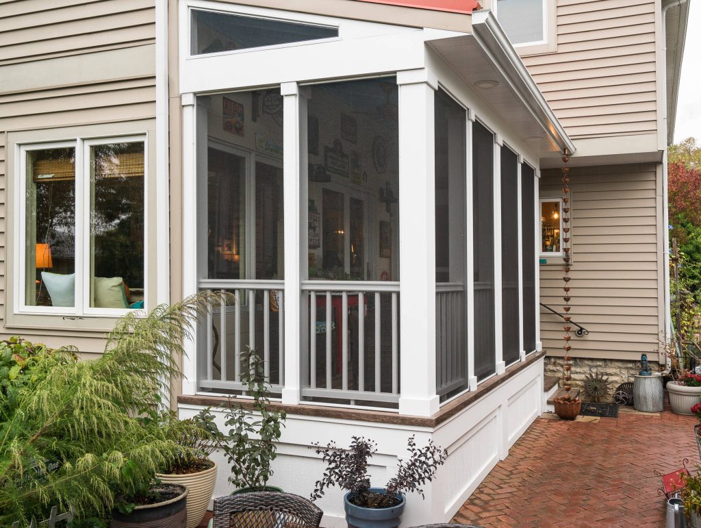 Exterior view screened porch addition, size 18’ x 6’7”, red metal roof Marshall Evan Photography