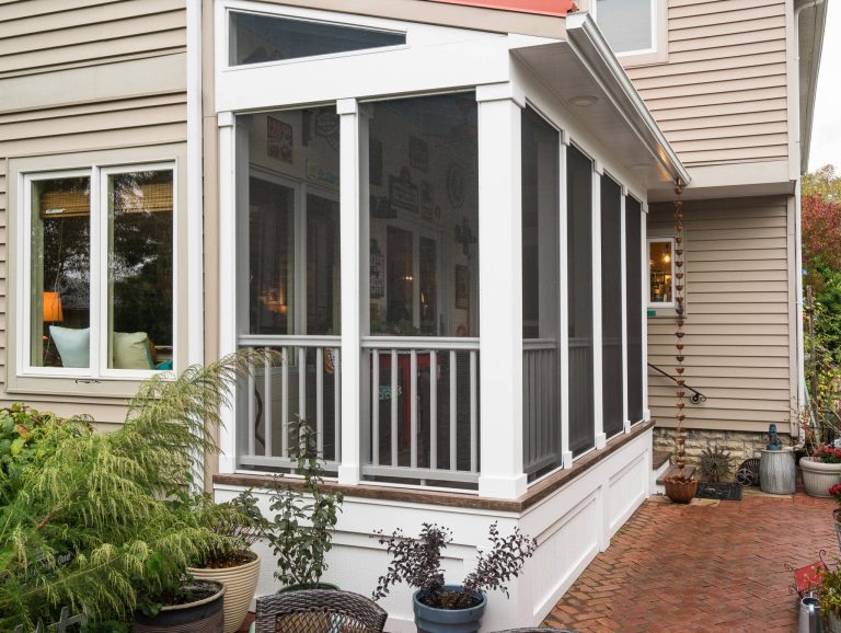 Exterior view screened porch addition, size 18’ x 6’7”, red metal roof Marshall Evan Photography