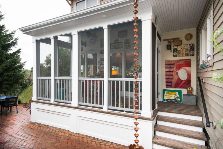 Exterior view screened porch addition, size 18’ x 6’7”, red metal roof, Zuri pvc decking, Timberteck Evolutions railing Marshall Evan Photography