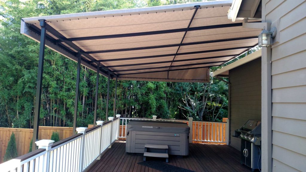 Fabric canopy covers deck and hot tub area