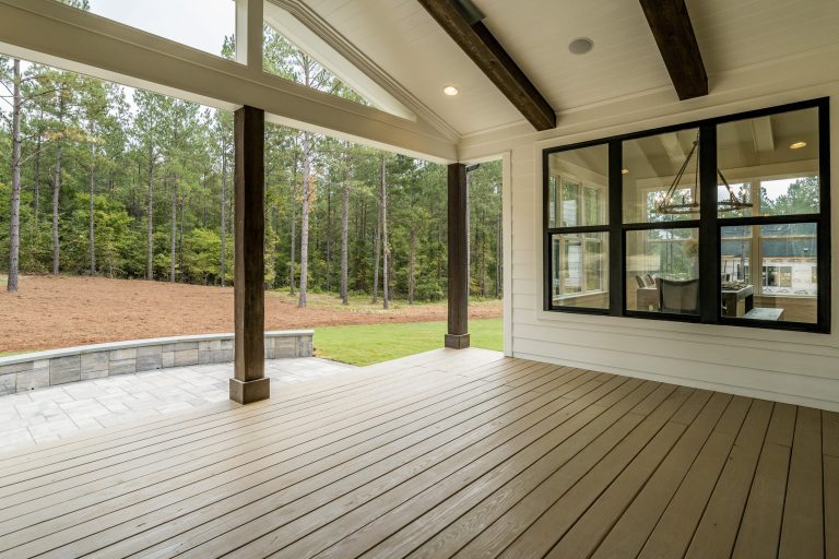 Farmhouse back porch idea in Raleigh with a fireplace by Poythress Construction Company Inc. | Outdoor Photos | Porch | Landscaping | Landscape Design | Outdoor Living Space | Porch Design Ideas | Outdoor Living Space Ideas | Backyard Design