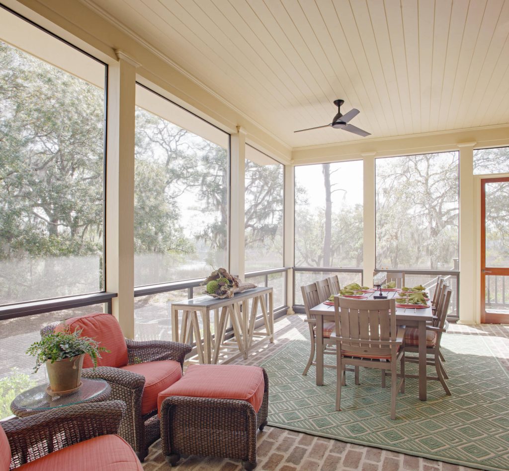 Farmhouse brick screened-in porch idea in Atlanta with a roof extension by Grady L Woods Architect, LLC | Outdoor Photos | Porch | Landscaping | Landscape Design | Outdoor Living Space | Porch Design Ideas | Outdoor Living Space Ideas | Backyard Design