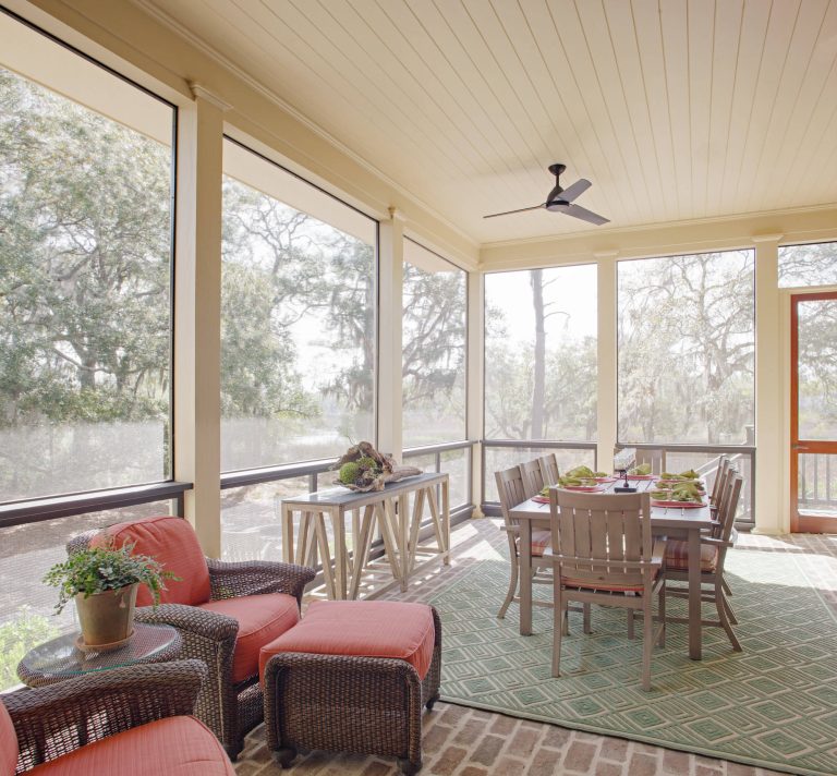 Farmhouse brick screened-in porch idea in Atlanta with a roof extension by Grady L Woods Architect, LLC | Outdoor Photos | Porch | Landscaping | Landscape Design | Outdoor Living Space | Porch Design Ideas | Outdoor Living Space Ideas | Backyard Design