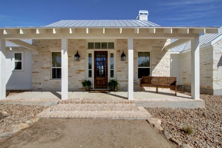 Farmhouse concrete front porch idea in Austin with a roof extension by Parker Homes | Outdoor Photos | Porch | Landscaping | Landscape Design | Outdoor Living Space | Porch Design Ideas | Outdoor Living Space Ideas | Backyard Design