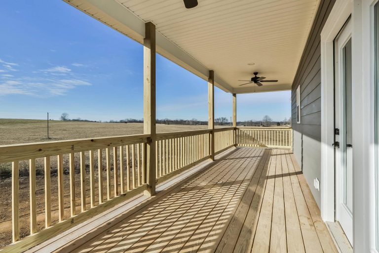 Farmhouse porch photo in Louisville by Blue Bird Heaven | Outdoor Photos | Porch | Landscaping | Landscape Design | Outdoor Living Space | Porch Design Ideas | Outdoor Living Space Ideas | Backyard Design
