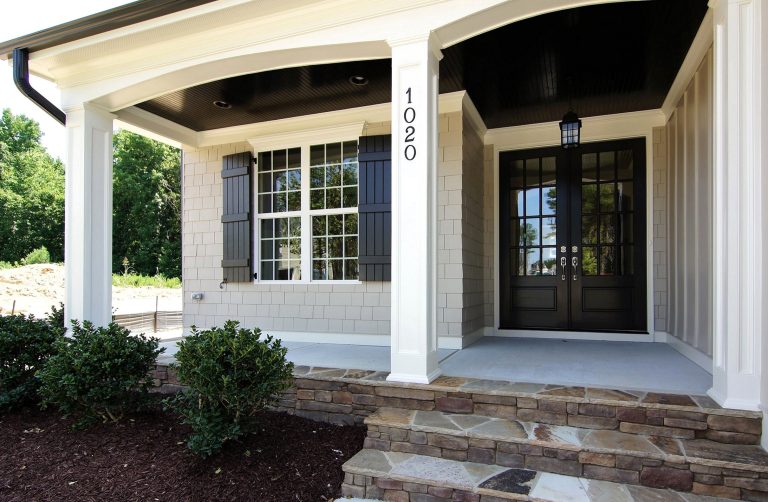 Flagstone steps up to the double entry doors