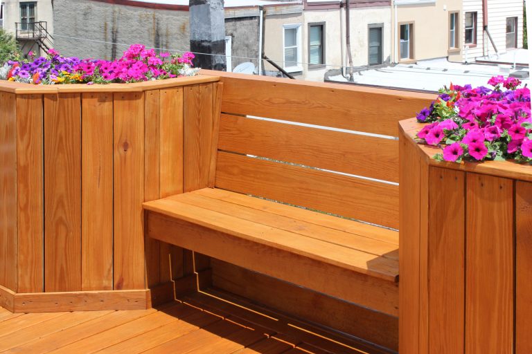 Floating bench ties together railing-height planters.