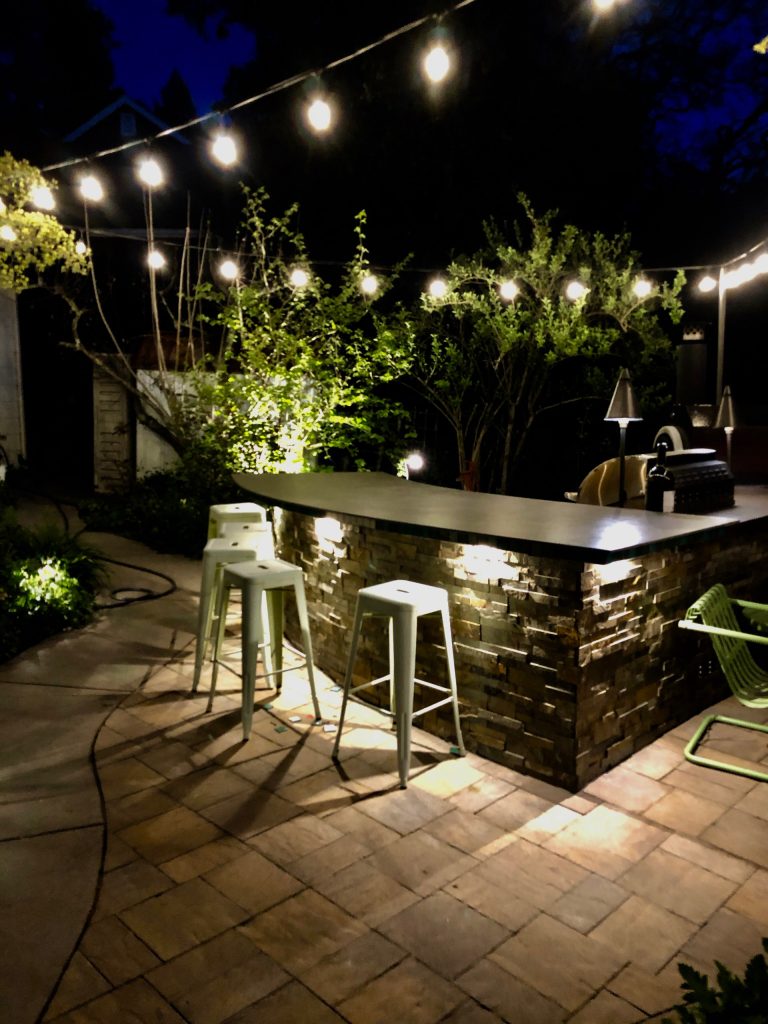 For years I planned on installing and Outdoor Kitchen and Entertainment Space in our Backyard. With a Kitchen command Center, Large fire-it and Plant collection Plantings. My Family enjoying the Firepit ! by Garden Lights Landscape and Pool Development Inc. | Outdoor Kitchens | Backyard Design | Outdoor Living Spaces | Landscape Design