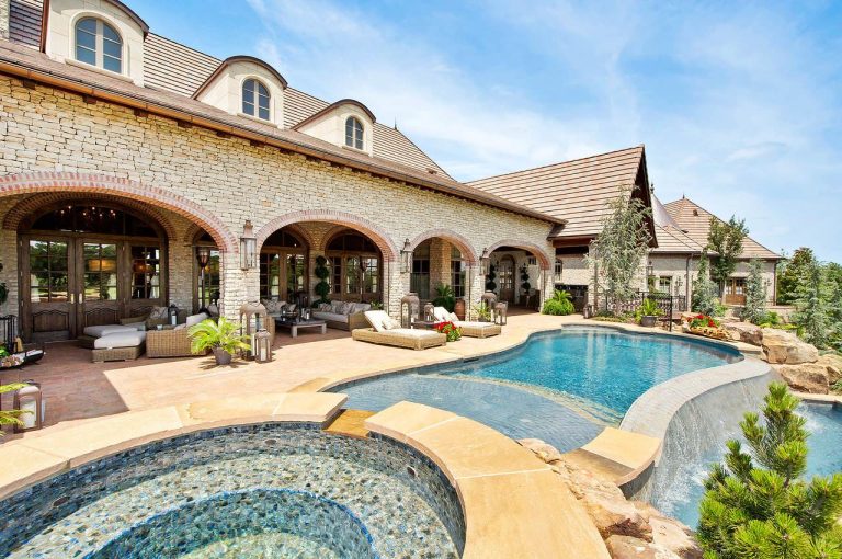 French country inspired back yard living spaces.