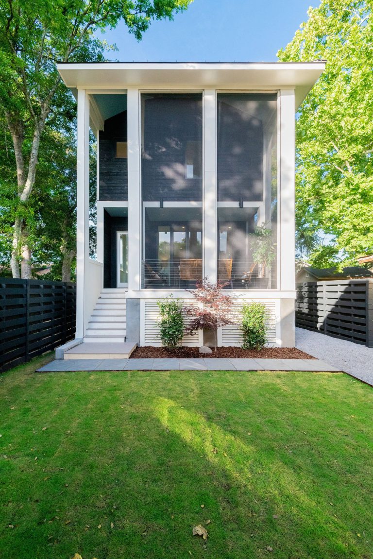 Front 2-storey screened porch of this modern Charleston home. Photos: Keen Eye Marketing