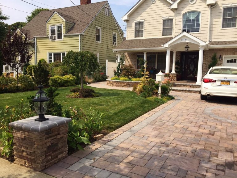 Front entry re-do with stone veneer, new front entryway, front landscape, walkway, driveway, light piers, portico