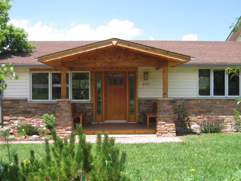 Front porch addition with Craftsman style clear pine door with stained glass. African mahogany decking and benches.