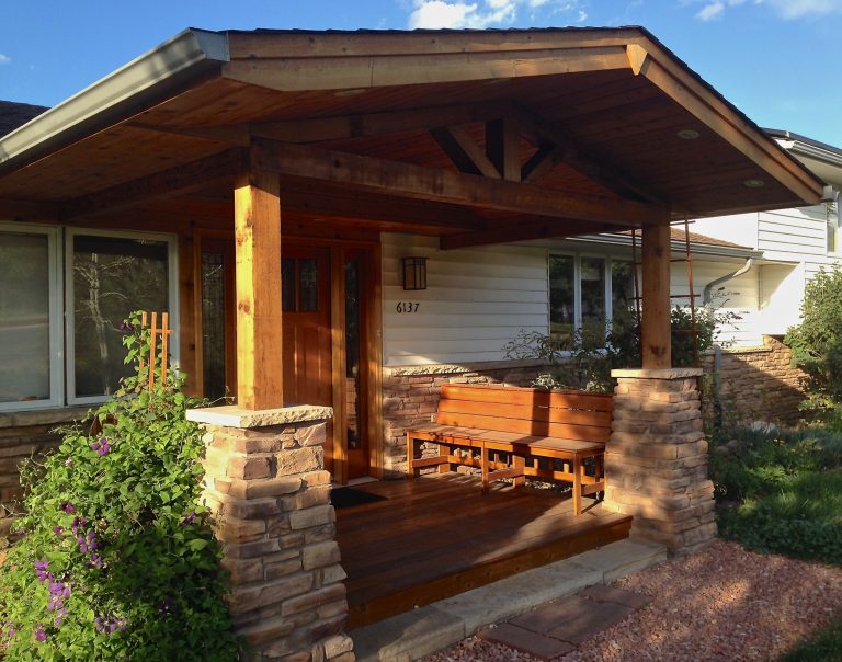 Front porch addition with stone columns, mahogany deck and benches, and timber framing. Note the stone veneer that matches the columns and covers the original brick "apron". by User | Outdoor Photos | Porch | Landscaping | Landscape Design | Outdoor Living Space | Porch Design Ideas | Outdoor Living Space Ideas | Backyard Design