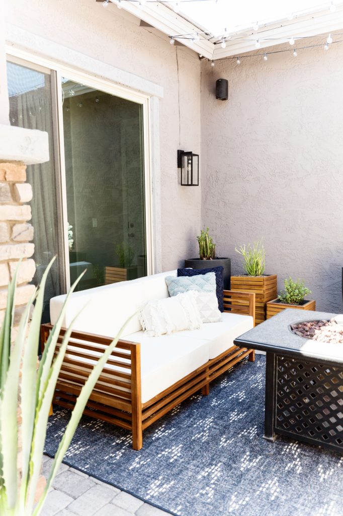 Front porch for the front of the house....firepit and sofas to give it warmth and inviting feel