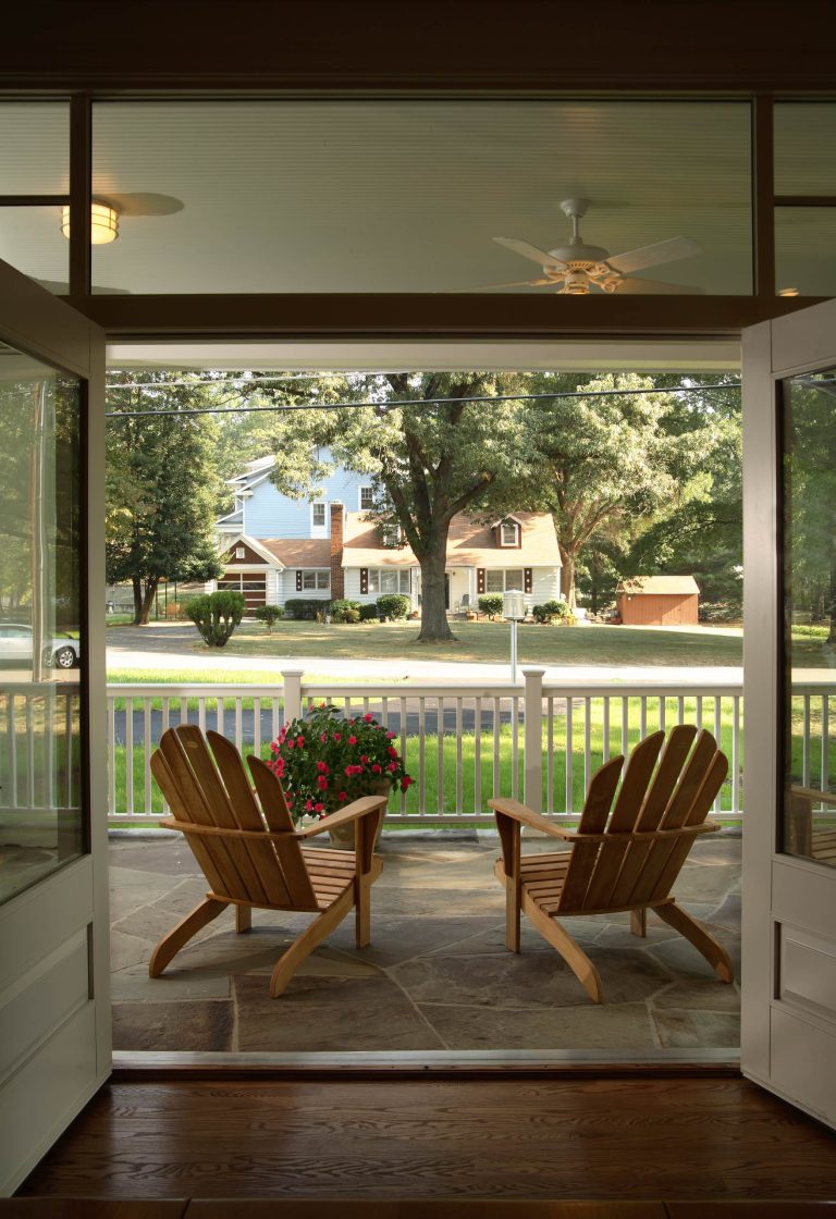 Front porch viewed from dining room, through double french doors. Architect: Susan Caughey Pierce Builder: Commonwealth Home Design