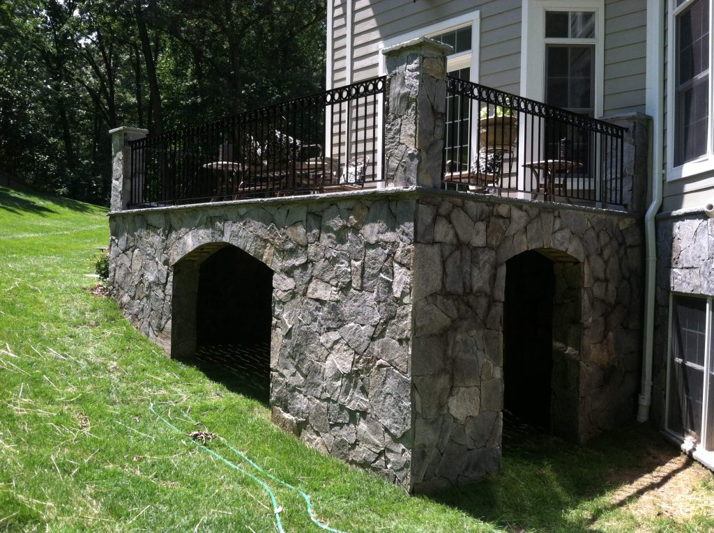 Good Star 703-819-1061 OUTDOOR renovation and remodel with flagstone semi-circle stairs, ornate railings, raised cooking island. Stone profile loggia.