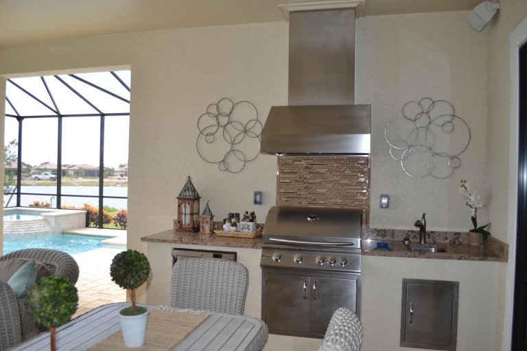 Great for entertaining, new construction builder, D. R. Horton, has created this outdoor kitchen next to the beautiful pool.