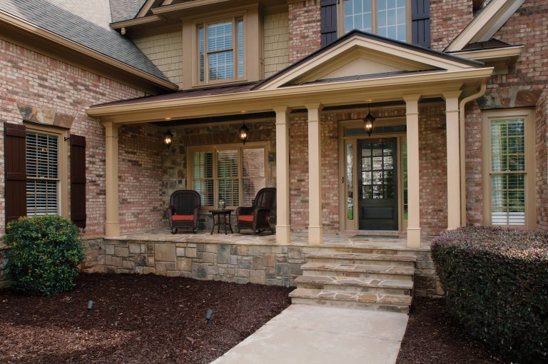 Half front porch with curved entry and square columns. Designed and built by Georgia Front Porch.