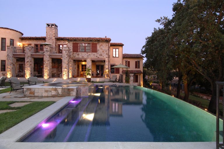 Hillside custom swimming pool and spa with a vanishing edge. This pool is sitting on 31 piers 20' deep. We had a very willing client with a great vision that we both shared.... by Creative Environments | Pool design | Pool Contracting | Swimming Pool Ideas | Swimming Pool Design Ideas