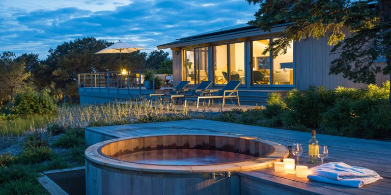 Hot tub - coastal round hot tub idea in Boston with decking