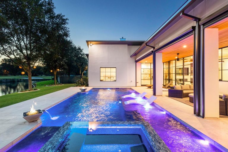 Hot tub - huge modern backyard tile and rectangular hot tub idea in Houston