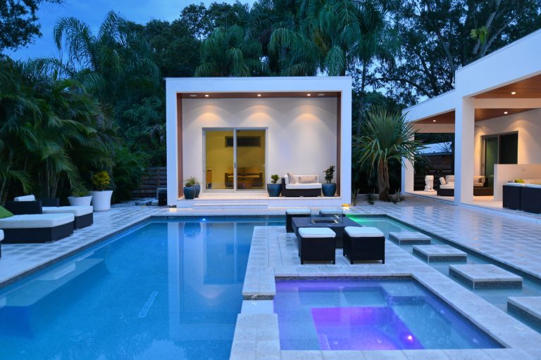 Hot tub - large contemporary backyard custom-shaped and concrete paver lap hot tub idea in Tampa