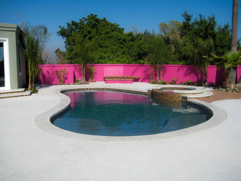 Hot tub - large contemporary backyard stamped concrete and custom-shaped natural hot tub idea in Los Angeles