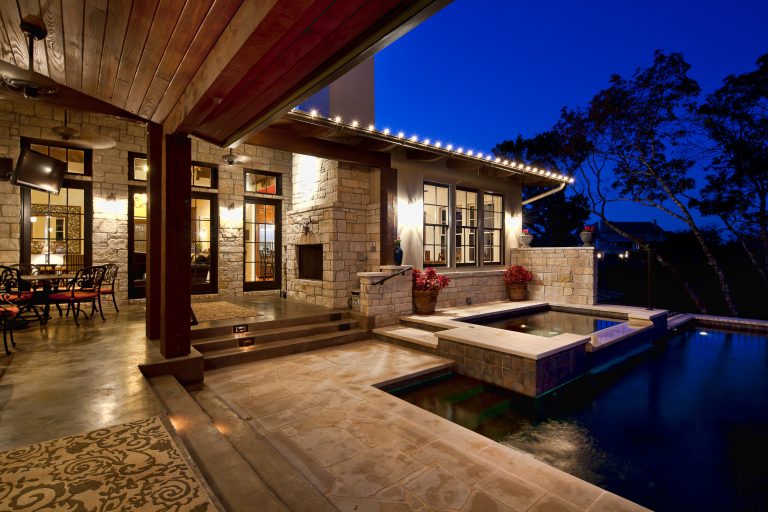 Hot tub - large modern backyard concrete and rectangular hot tub idea in Austin