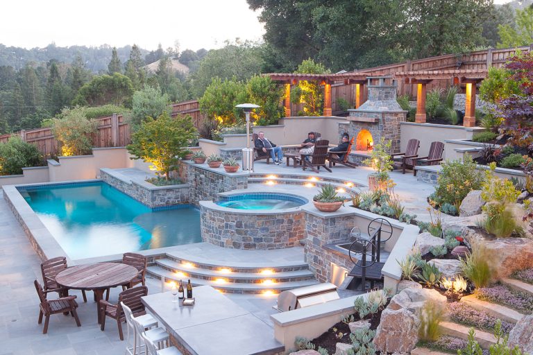 Hot tub - large transitional backyard stone and l-shaped hot tub idea in San Francisco