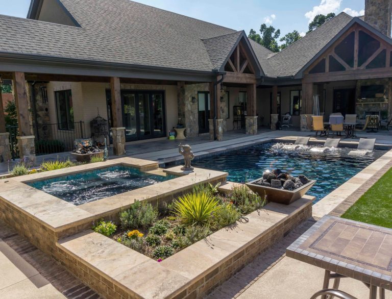Hot tub - mid-sized rustic backyard concrete paver and rectangular lap hot tub idea in Other