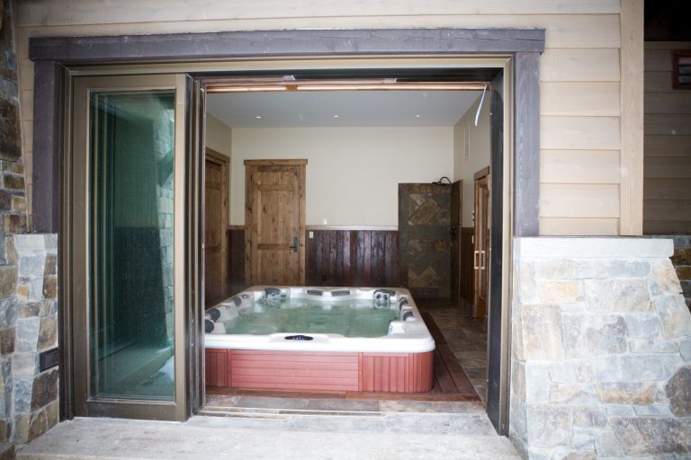 Hot tub - mid-sized rustic indoor hot tub idea in Salt Lake City